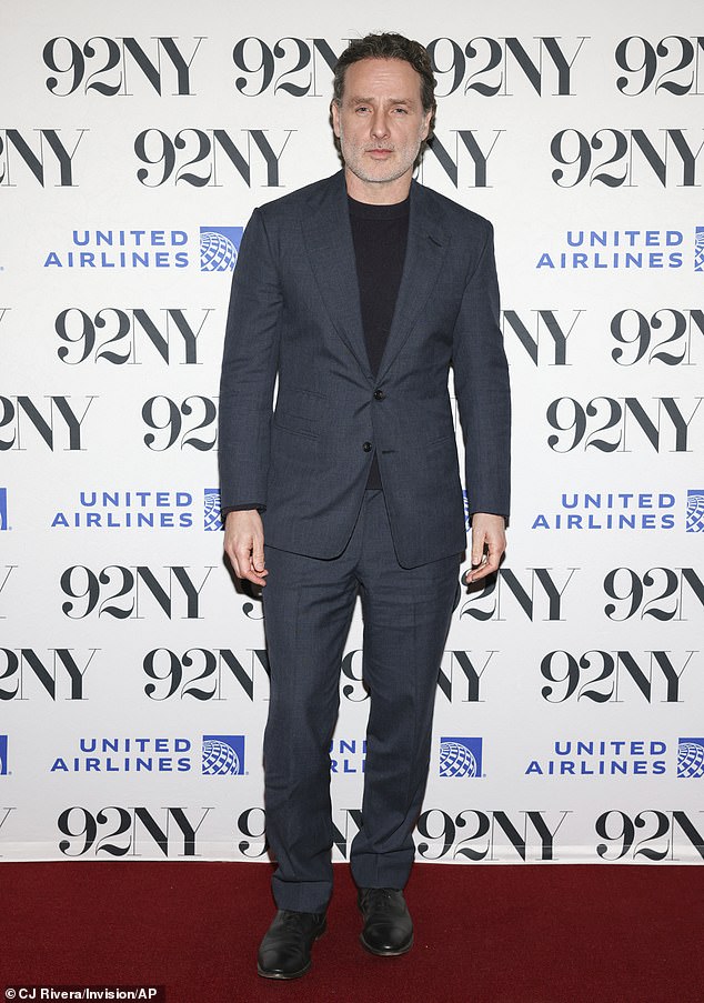 Lincoln stepped out with a black t-shirt under a dark blue suit coat and matching dark blue pants with black dress shoes.
