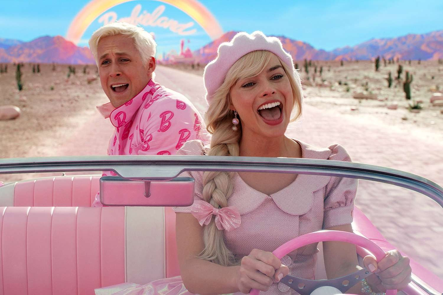 Ryan Gosling screaming behind Margot Robbie in a still from Barbie