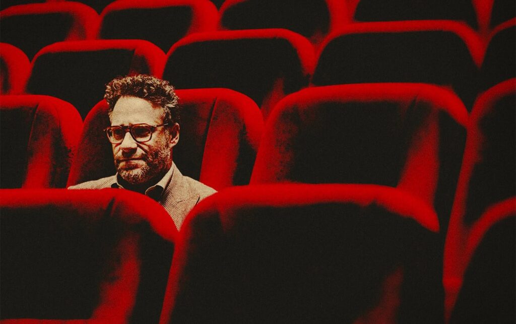 Yes, 'The Studio' Episode 6 Tries to Justify That Bizarre Zombie Diarrhea Movie - And Somehow, It Works 1 Seth Rogen sitting in a viewing scene, in The Studio