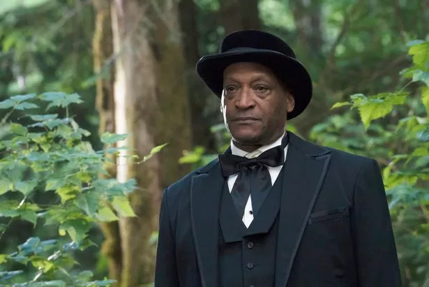 Tony Todd wearing black