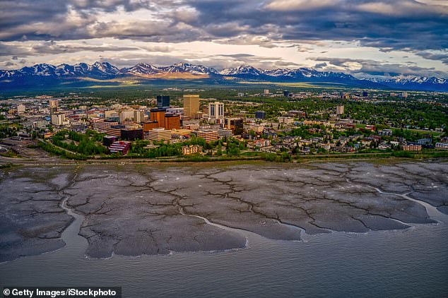 Mount Spurr also sits about 78 miles from Anchorage (pictured), home to nearly 300,000 people, which would be blanket in thick volcanic ash