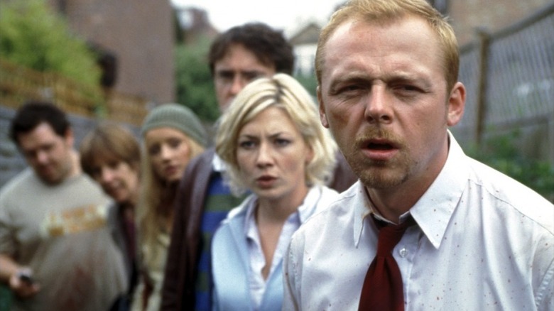 The cast of Shaun of the Dead, with Simon Pegg's Shaun in focus at the front