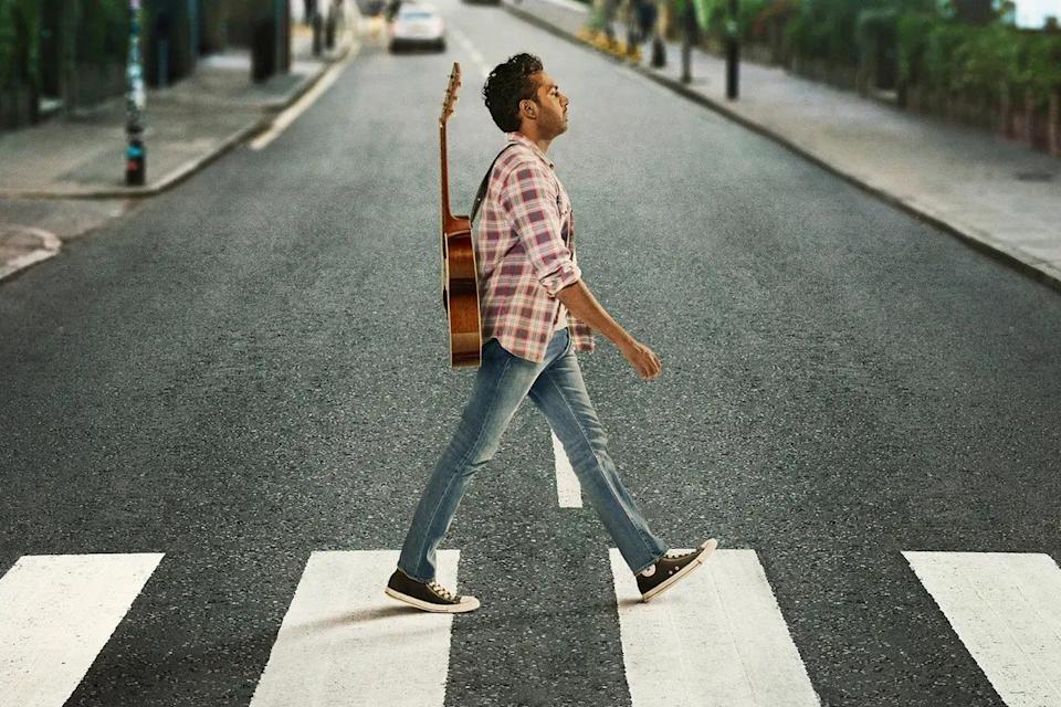 Himesh Patel walking across a street