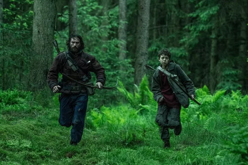 Aaron Taylor-Johnson, who plays Jamie, and Alfie Williams as son Spike in 28 Years Later.  Credit: Sony Pictures