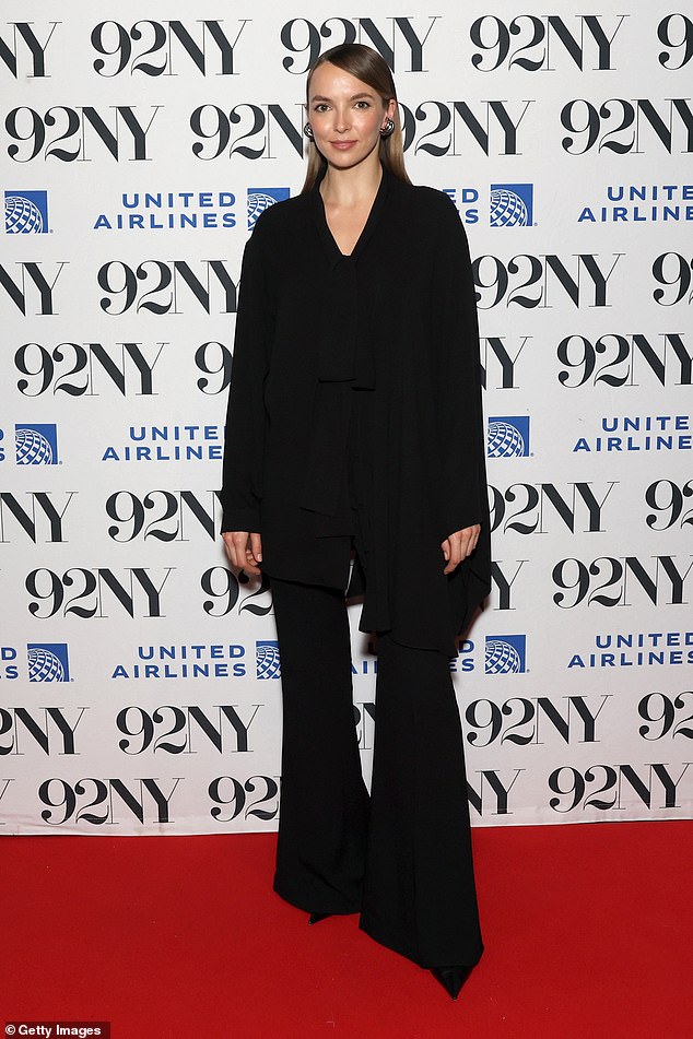 Meanwhile Jodie was the epitome of chic in a flowing black blouse which was worn with bell bottoms and pointed heels