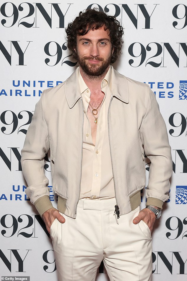 British actor Aaron, 34, who sported a bushy beard, smouldered as he flashed a glimpse of his hairy chest in an open shirt while taking to the red carpet