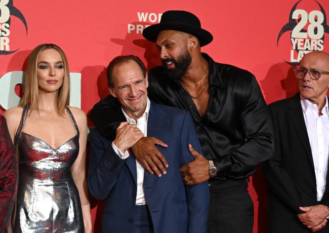 LONDON, ENGLAND - JUNE 18: (L-R) Jodie Comer and Ralph Fiennes and Chi Lewis-Parry attend the