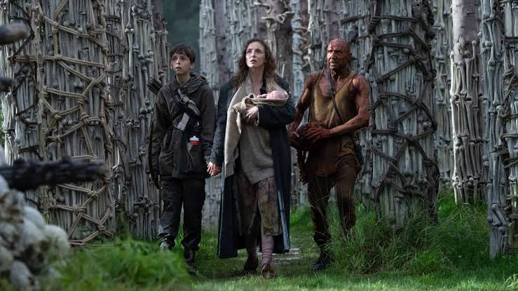 Alex Garland Thinks This 1996 Video Game Should Be Credited for Reviving the Zombie Genre, Not 28 Days Later 2 Spike and Isla with Dr. Ian traveling through the forest with a newborn baby