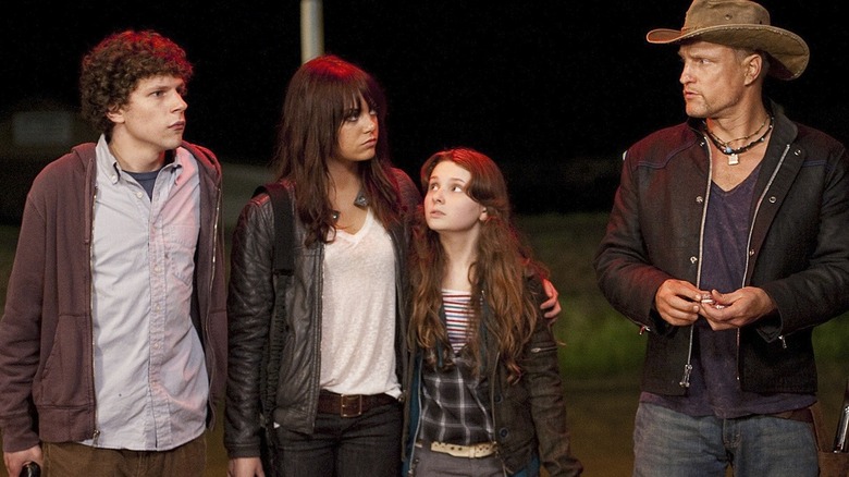 Columbus (Jesse Eisenberg), Wichita (Emma Stone), Little Rock (Abigail Breslin), and Talahassee (Woody Harelson) standing together in 