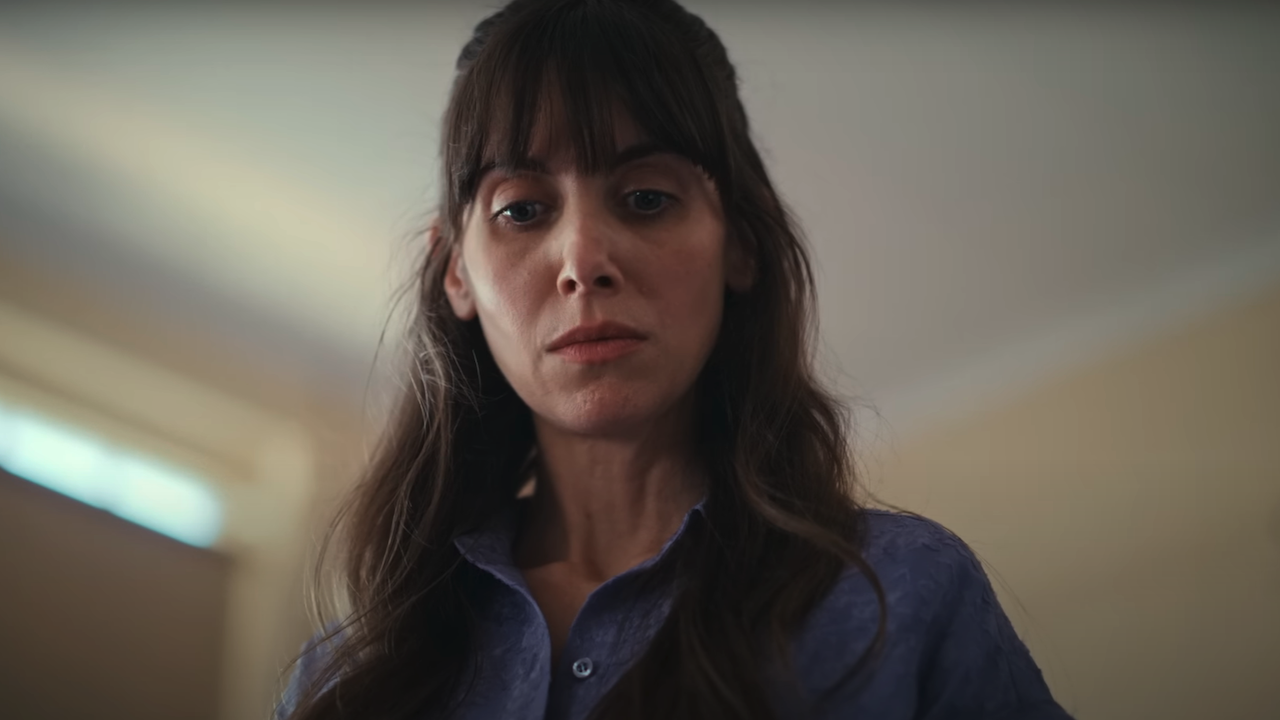 Alison Brie looking down in terror in Together