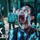 Zombie man with a blood-soaked face screaming in a crowded mall; foreground displays '4K TRAILER' text overlay.